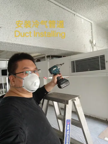 Handyman fixing brackets for a ceiling duct unit with a cordless driver