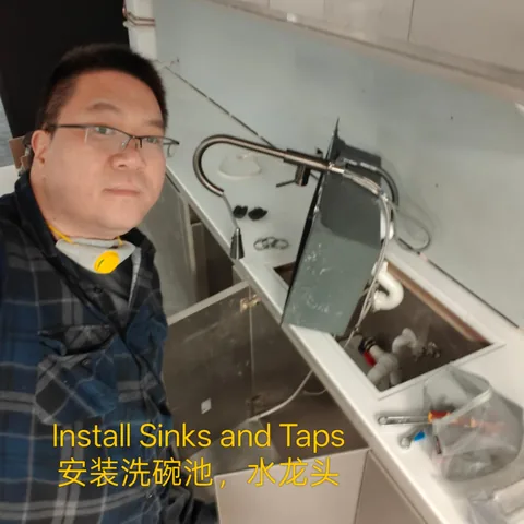 Kitchen sink and mixer tap fit-off shown during a renovation