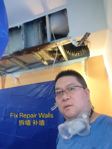 Opened wall and ceiling section with dust protection sheeting in place
